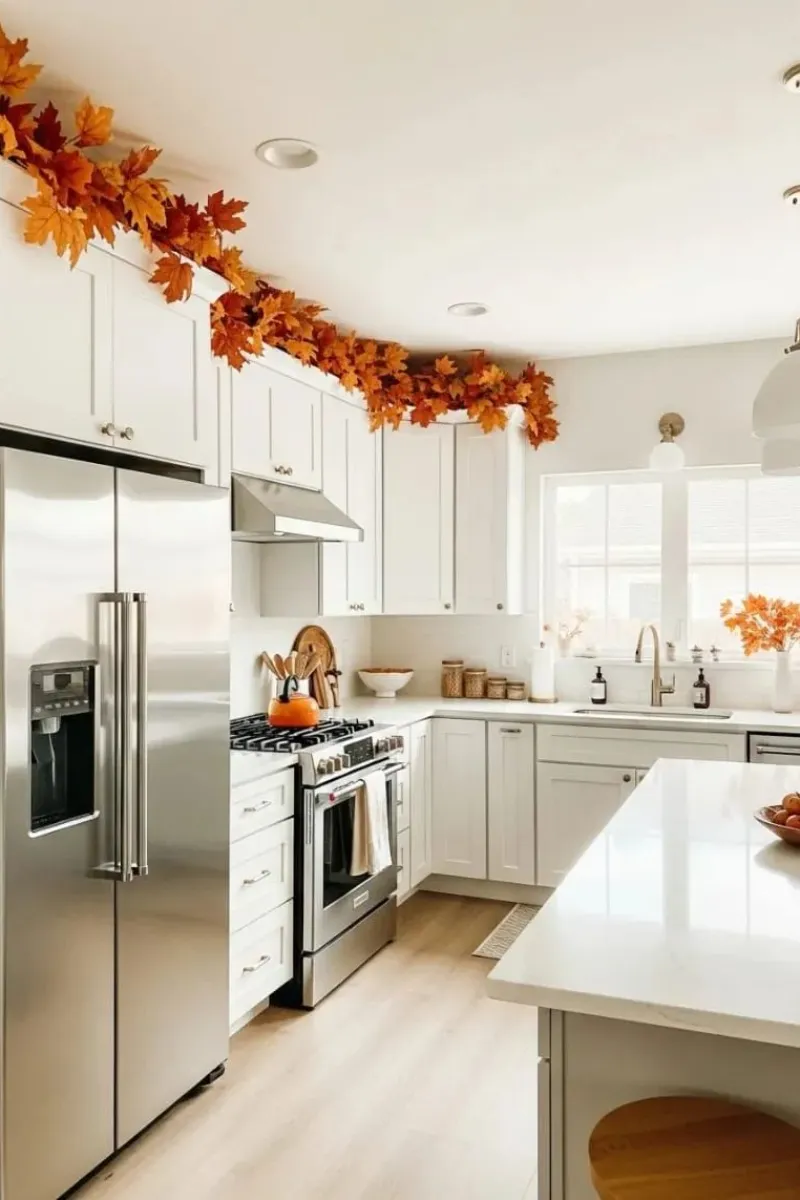10 Decorating Ideas for Above Kitchen Cabinets to Transform Your Kitchen 7 a kitchen with autumn leaves decor above cabinets