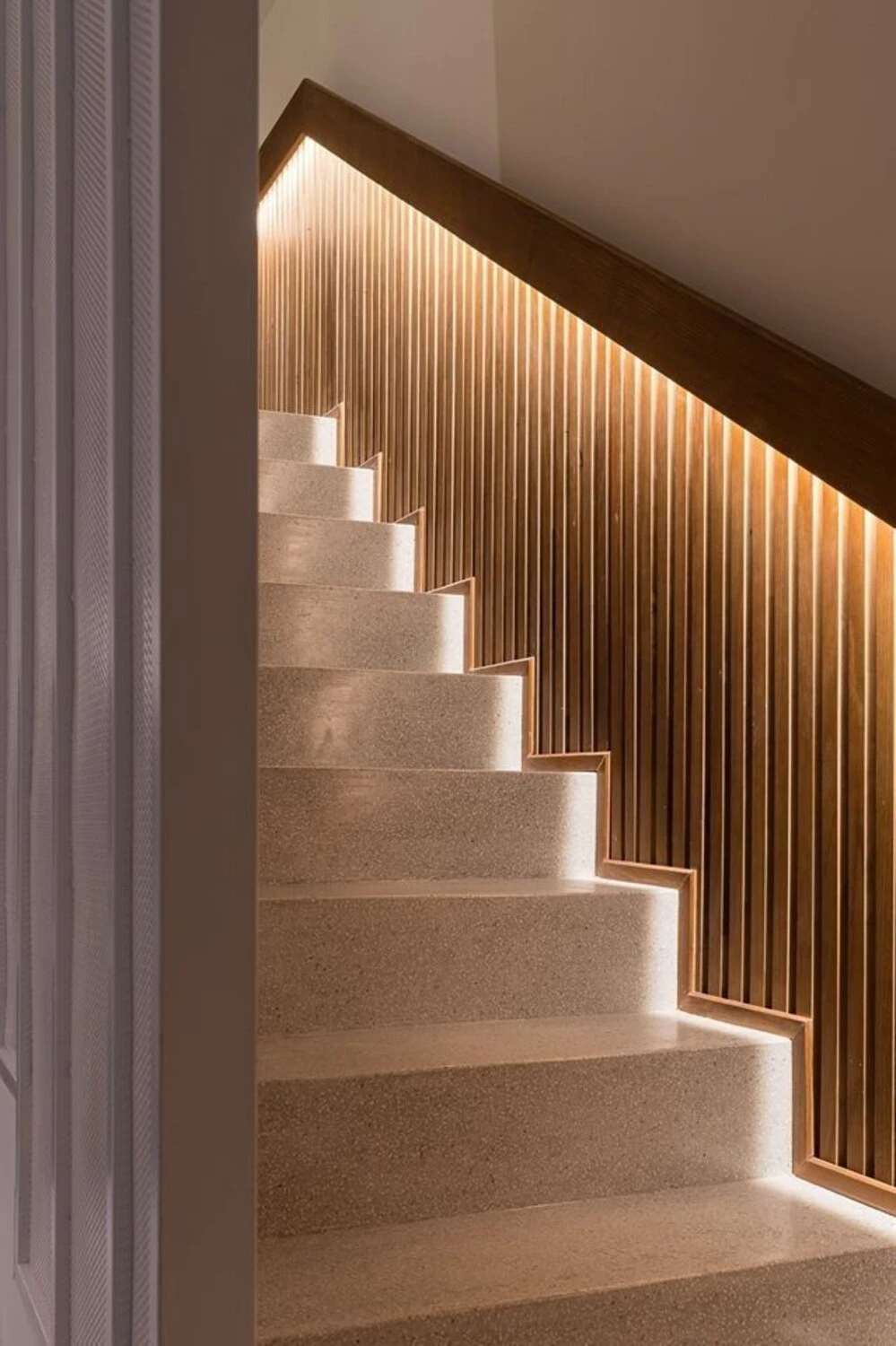 a staircase wall decorated with hidden led lights