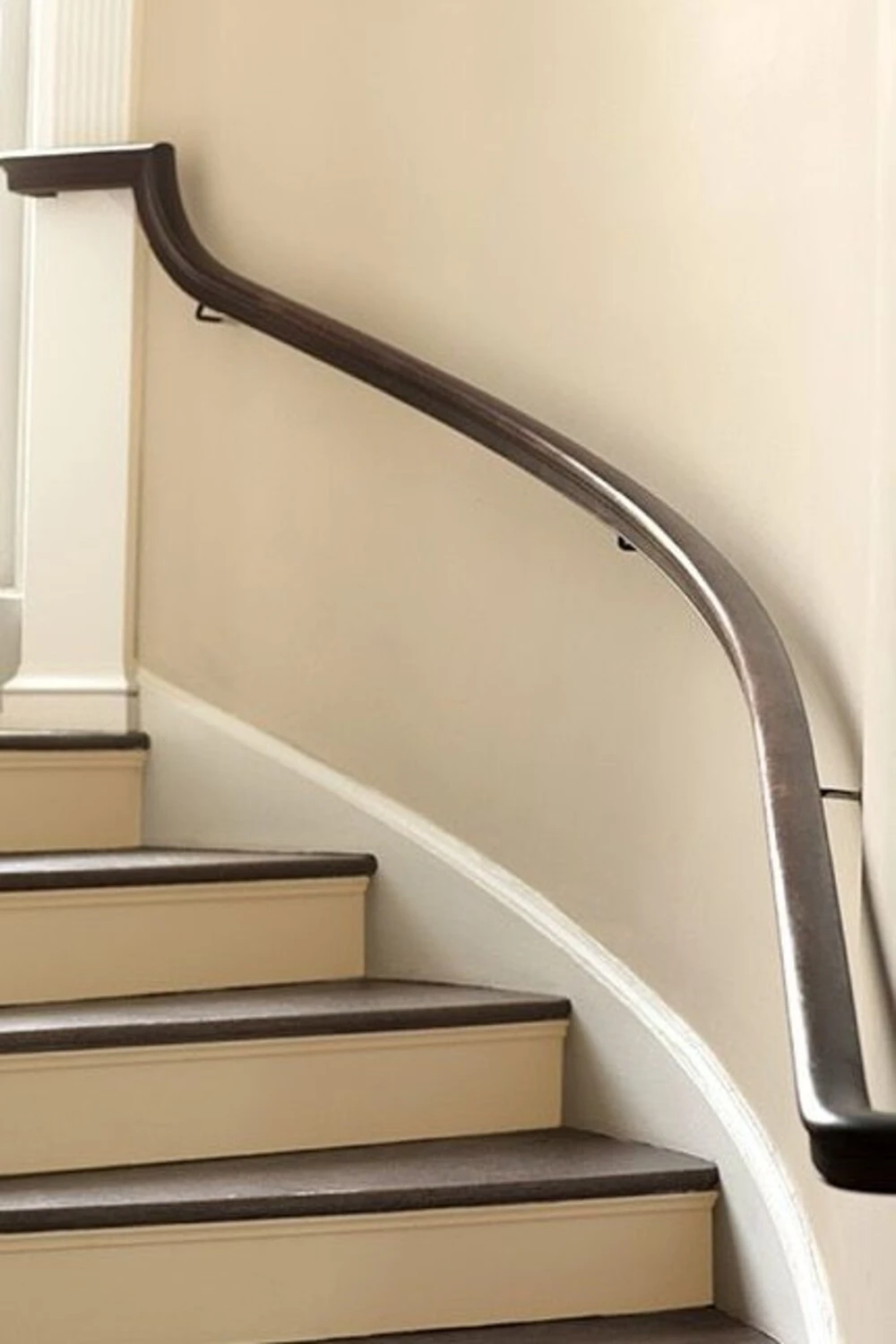 a staircase wall decorated with beige paint