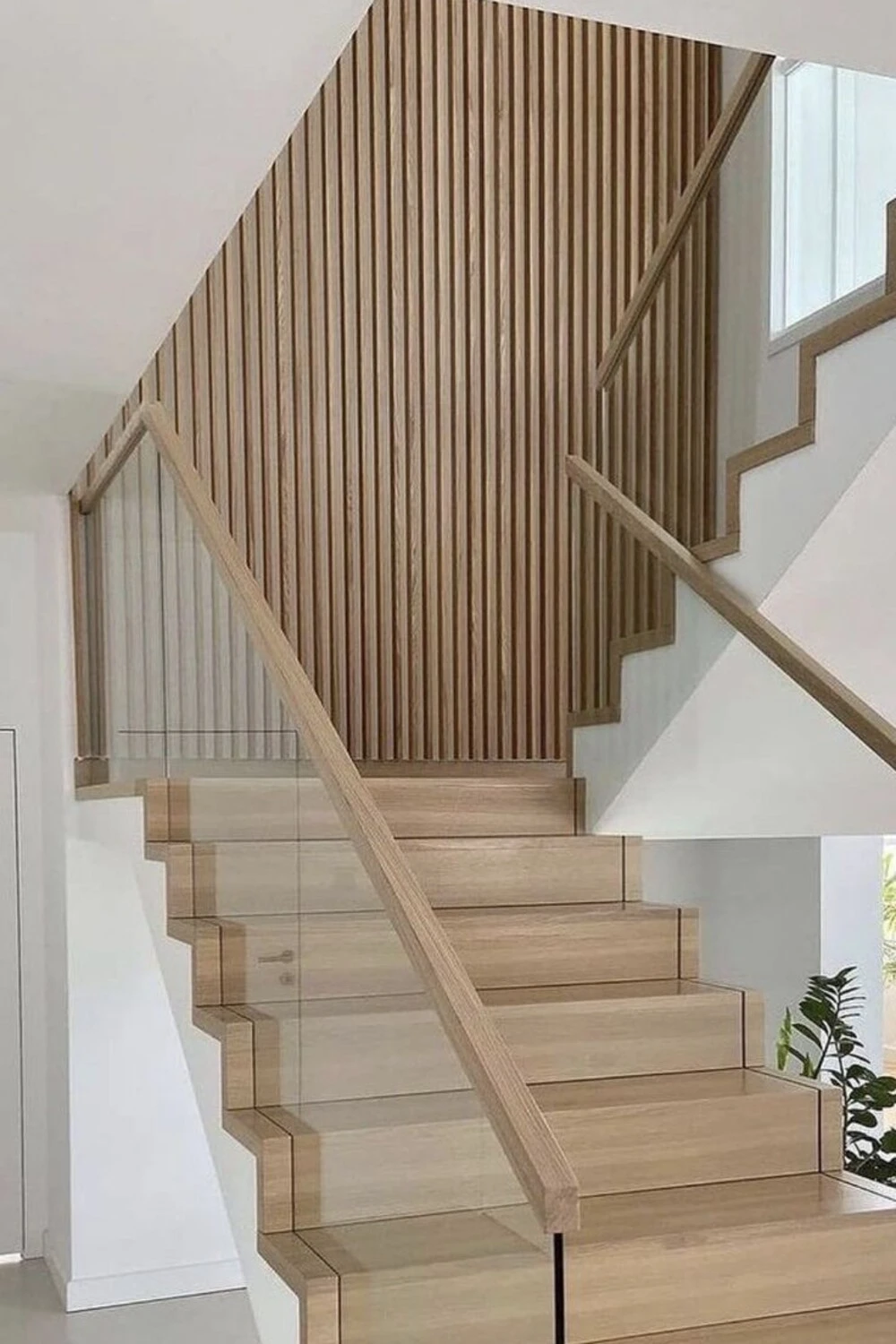 a staircase wall decorated with wall panels