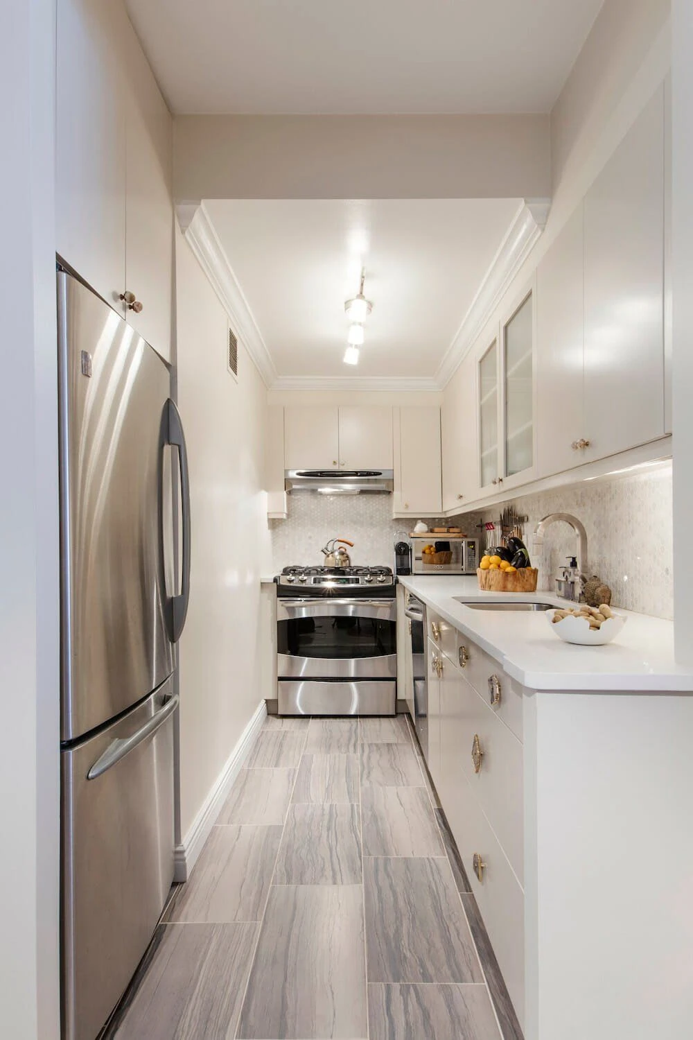 Short on Space? 10 Basement Galley Ideas That Work 2 a basement galley kitchen in all white