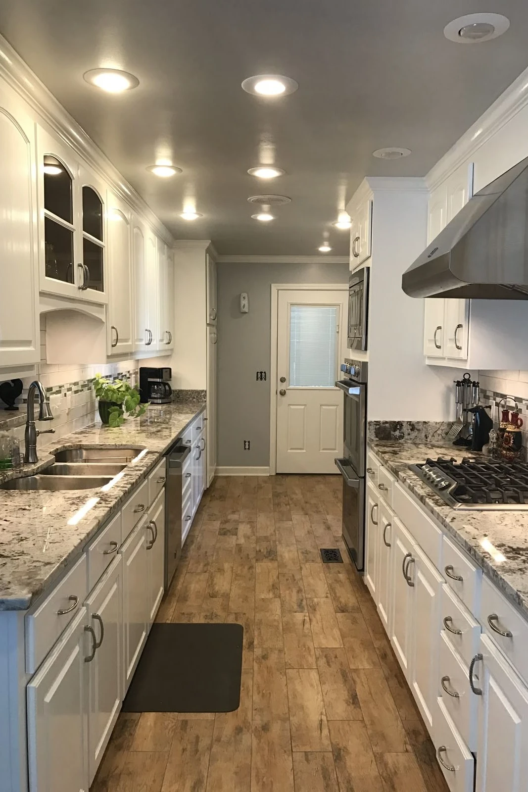 Short on Space? 10 Basement Galley Ideas That Work 5 a basement galley kitchen with appliances hiden in panels