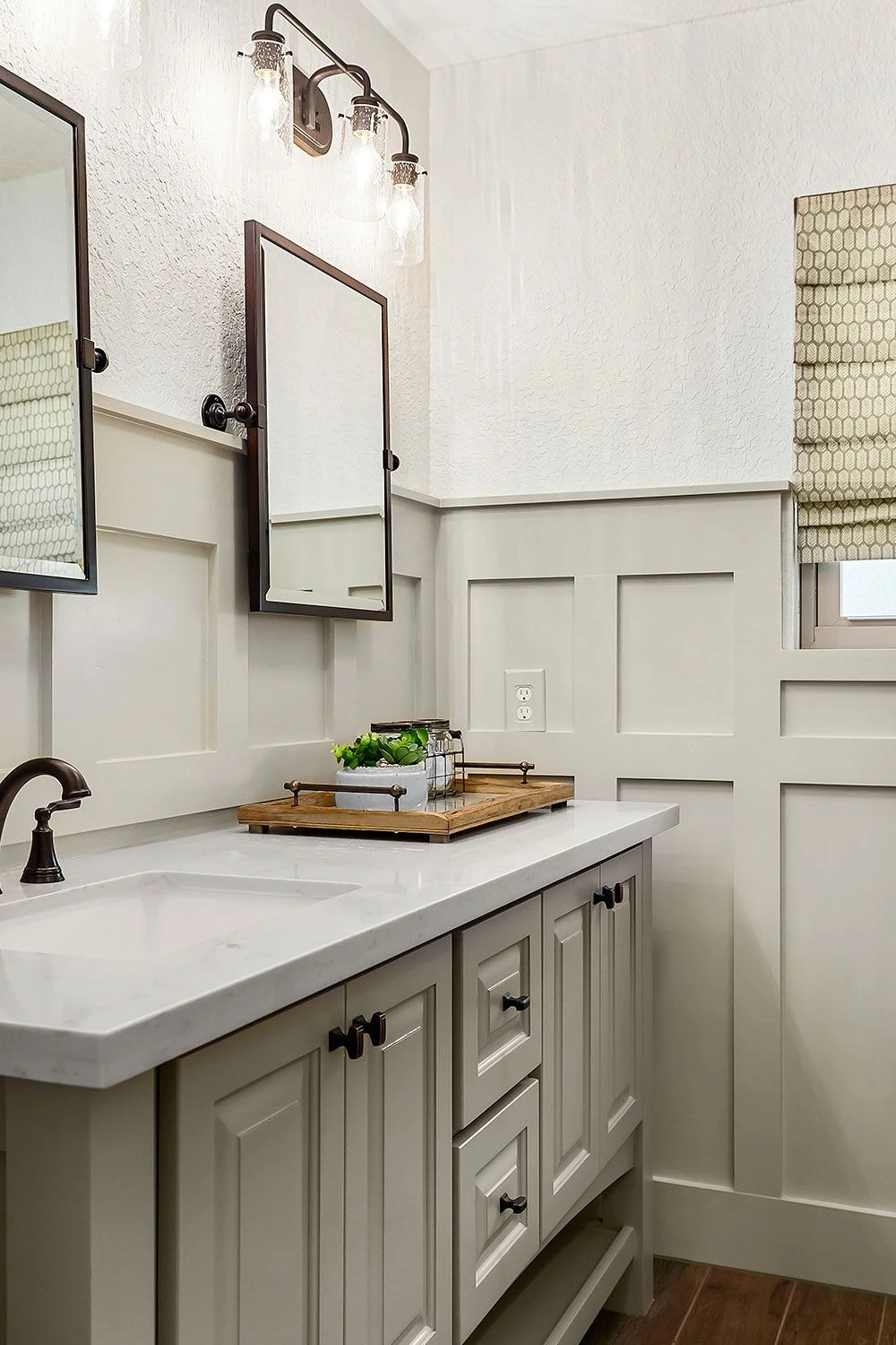 a bathroom with board and battan wainscoting