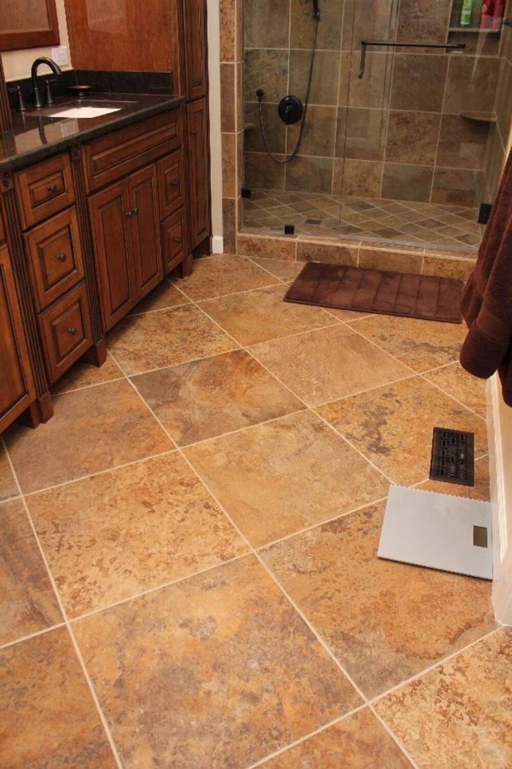 a small bathroom floor tile in diagonal layout