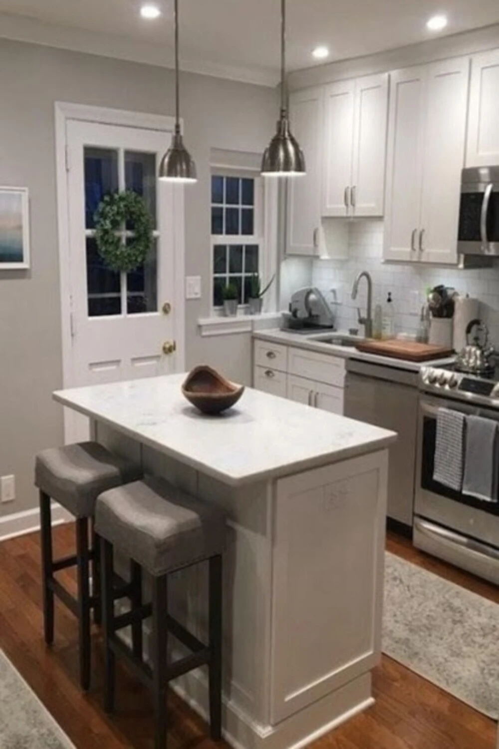 a small one-wall basement kitchen with island