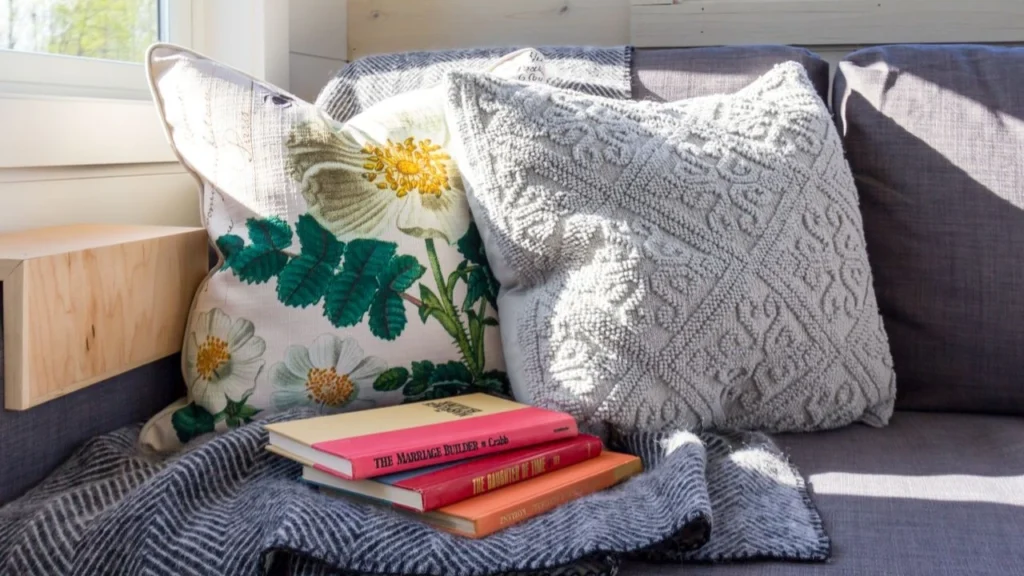 reading nook near windows with blanket pillows