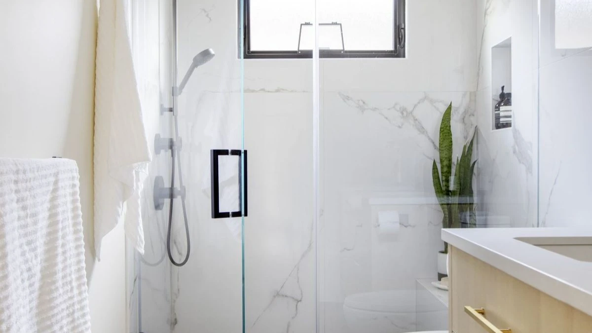 How to Design a Small Bathroom Shower: 12 Space-Saving Ideas 1 a small bathroom with large format tiles
