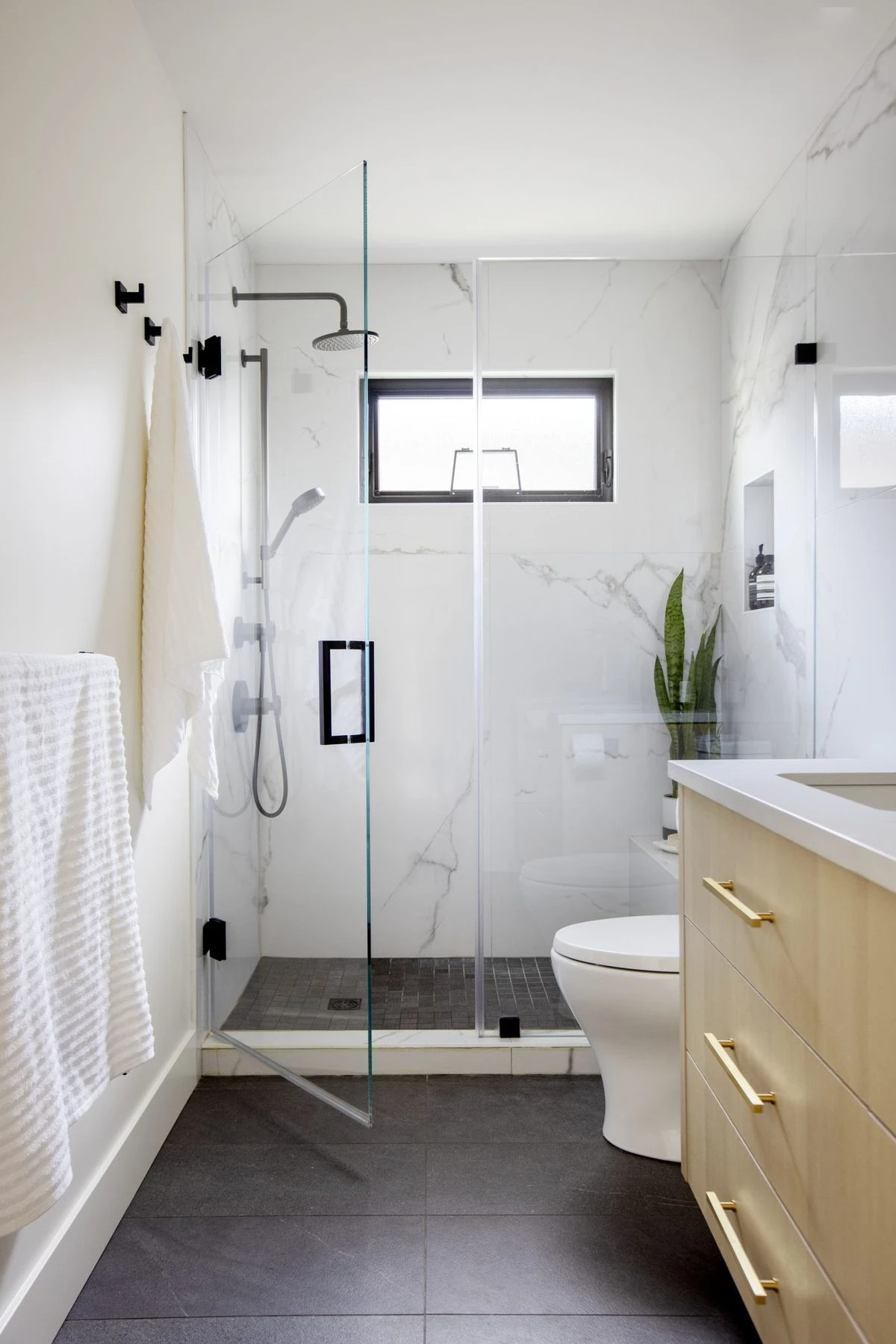 How to Design a Small Bathroom Shower: 12 Space-Saving Ideas 12 a small bathroom with large format tiles