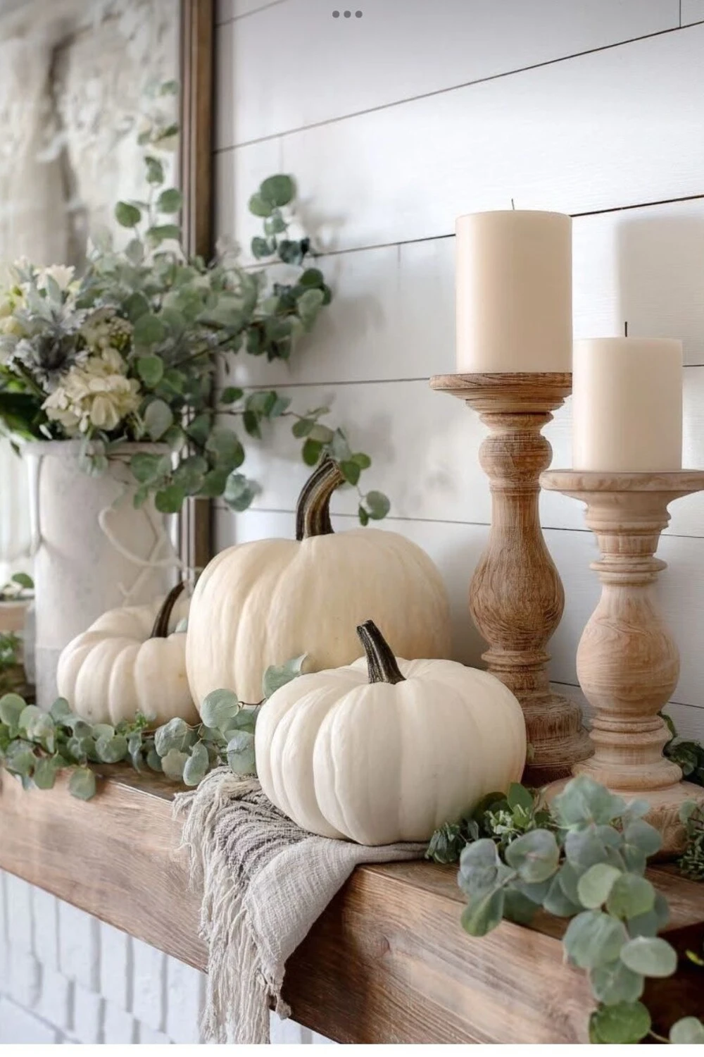 cream pumpkins on mantel