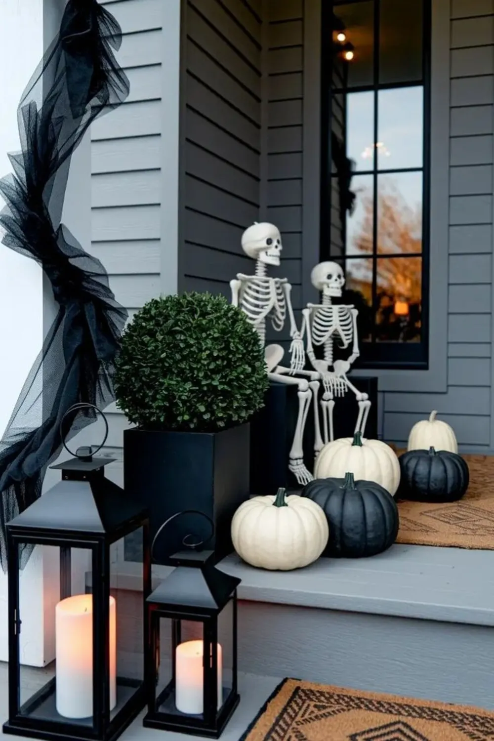 black and white pumpkins near front door