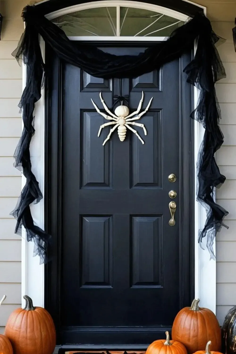 black front door with a black ribbon