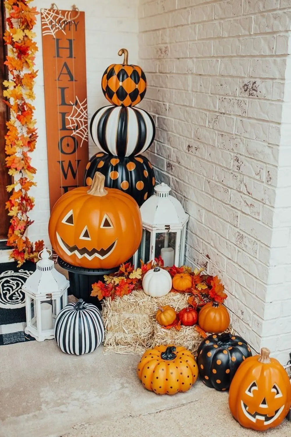 various size pumpkins near front door