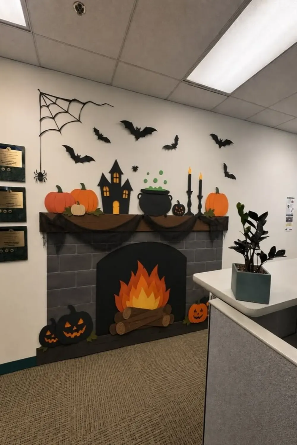 office wall with halloween paper bats and mantel